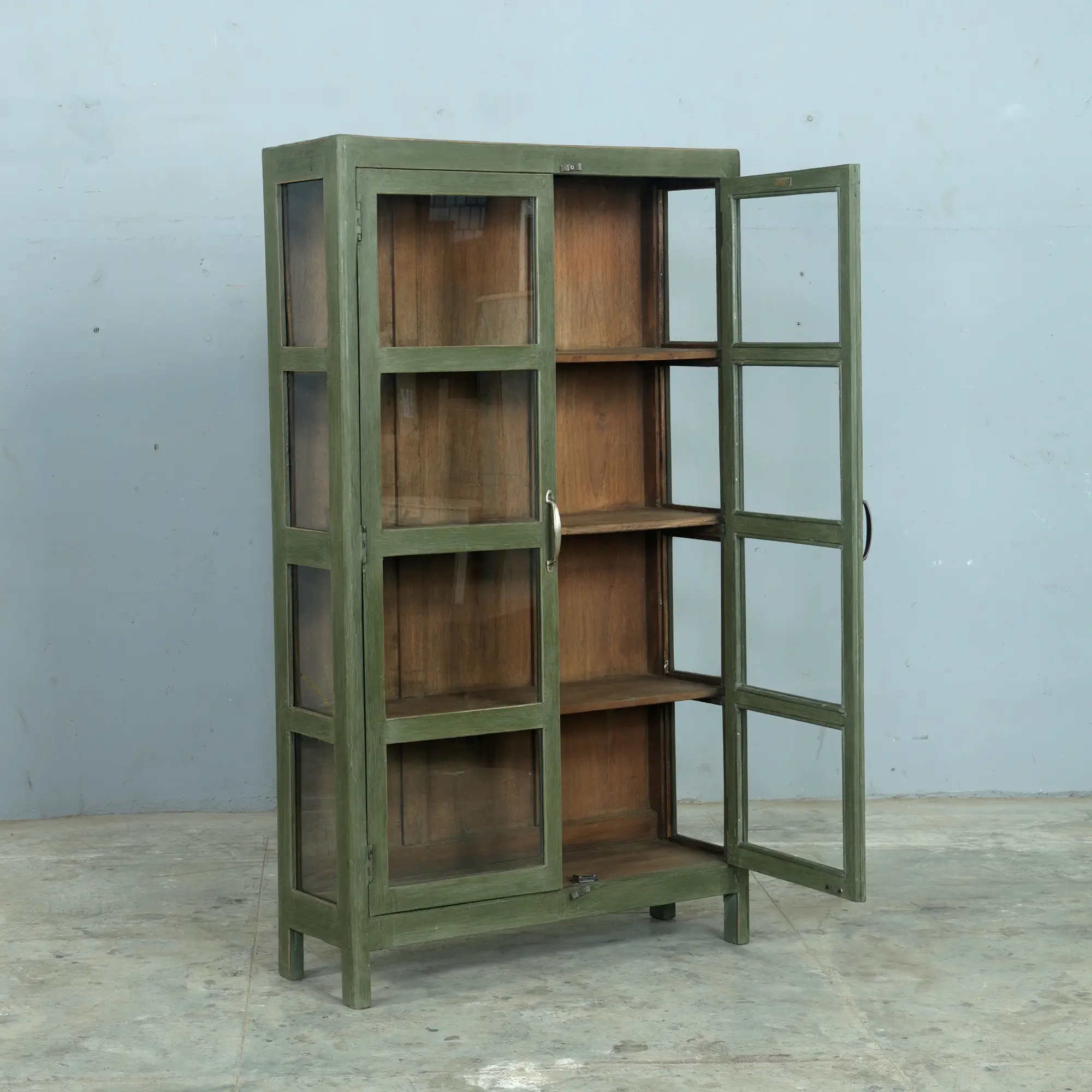 Vintage teak cabinet in a gorgeous olive green with brass handles. Ideal for a kitchen