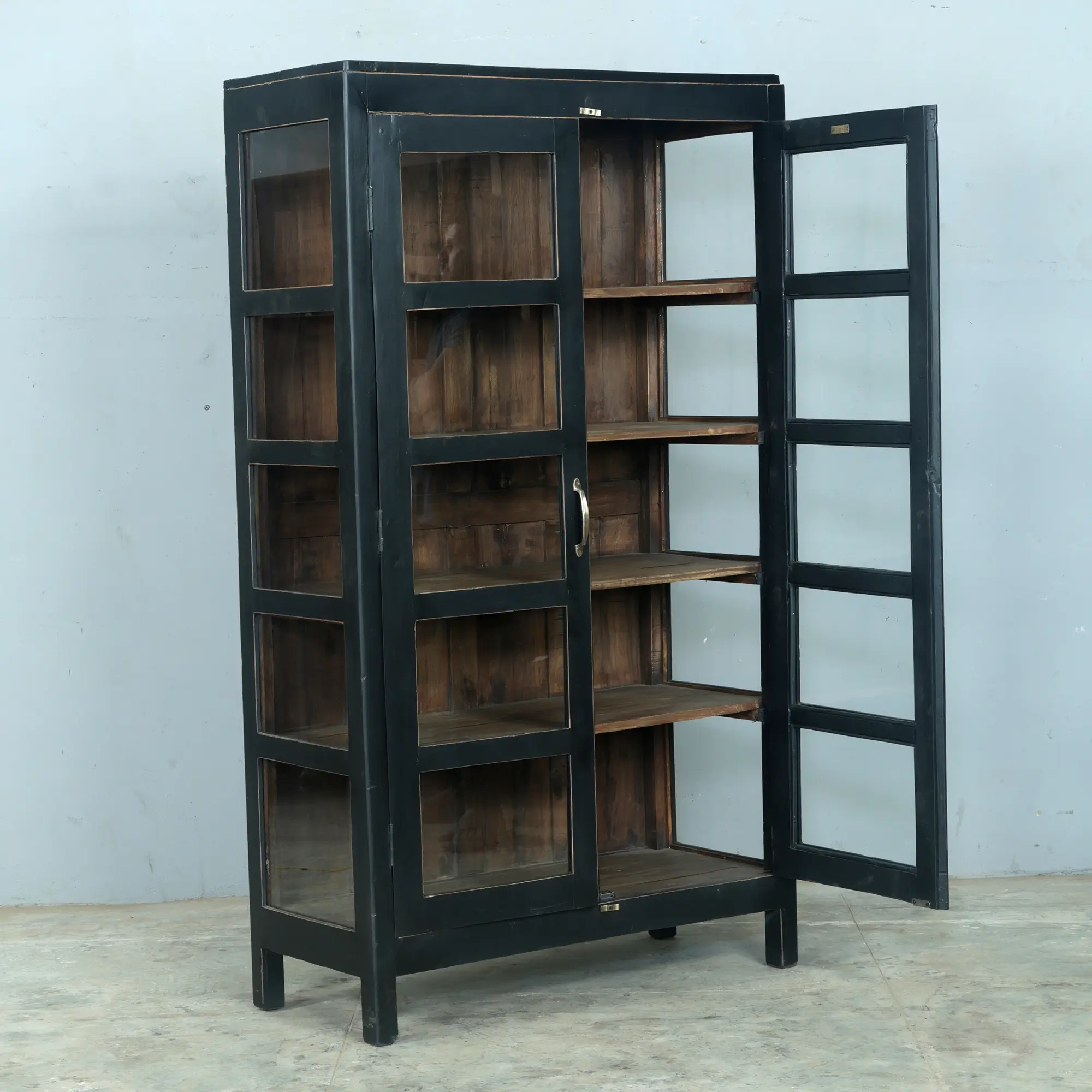 Stunning vintage cabinet in Soulosofie black with brass handles. The interior has been left unpainted so the natural colour of the teak shows through