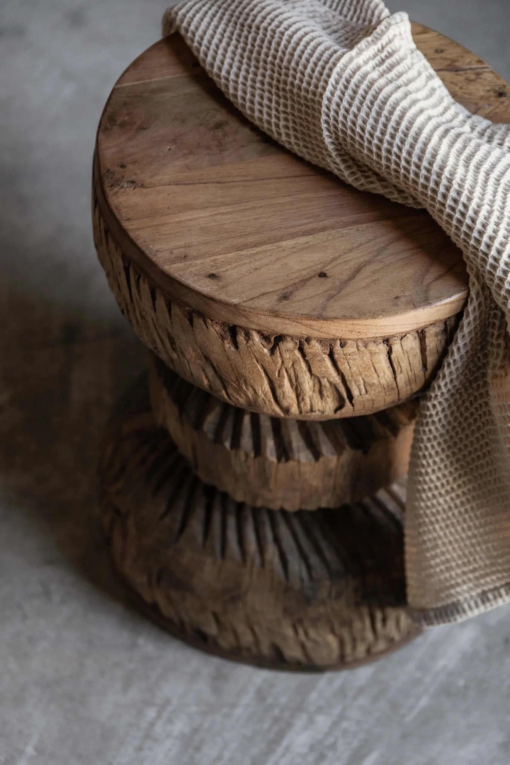 Vintage carved wood stool with hand-carved sunburst detail and natural worn finish — Soulosofie Mallorca