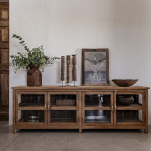Reclaimed teak sideboard with four glass doors and open shelves, styled with vintage ceramics and eucalyptus — Soulosofie Mallorca