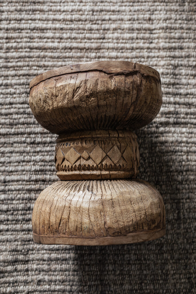 Vintage carved wood stool with hand-carved sunburst detail and natural worn finish — Soulosofie Mallorca