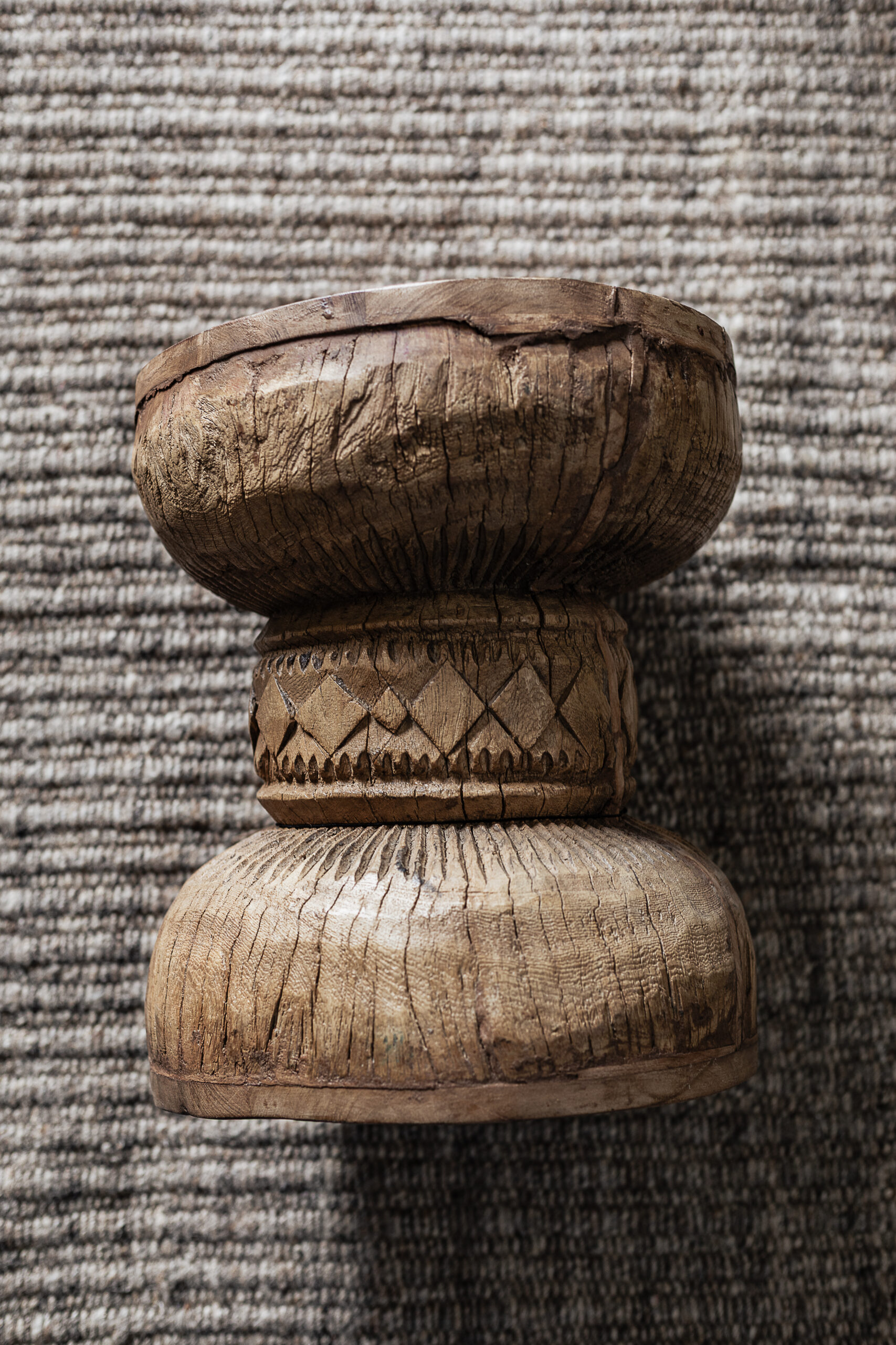 Vintage carved wood stool with hand-carved sunburst detail and natural worn finish — Soulosofie Mallorca