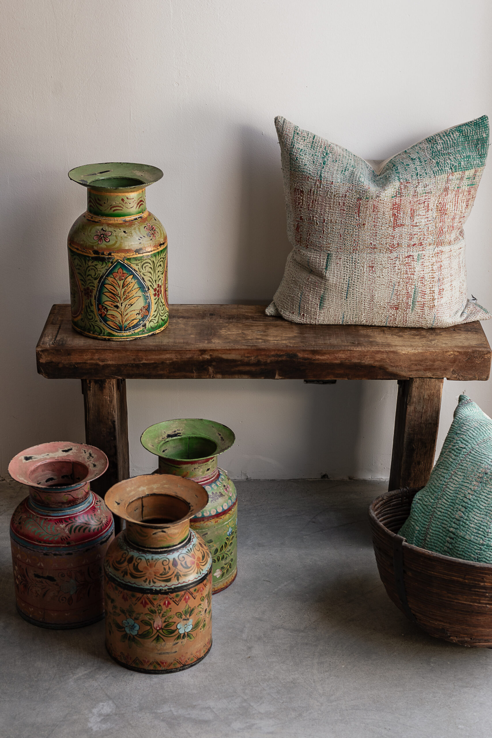 Collection of vintage Indian handpainted iron pots with colourful floral motifs in green, pink and yellow — Soulosofie Mallorca