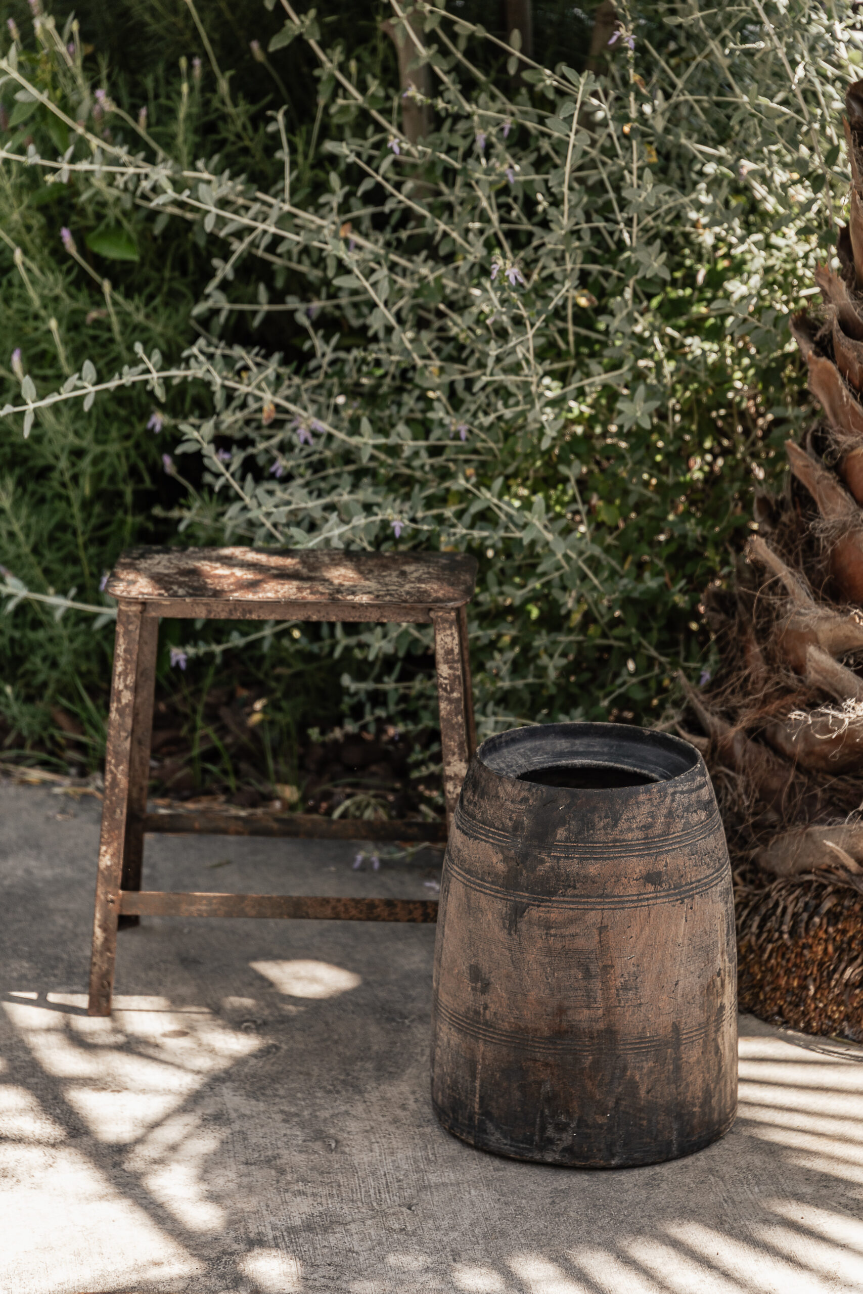 Vintage tall wooden barrel pot with natural worn finish, styled outdoors in a Mediterranean garden — Soulosofie Mallorca