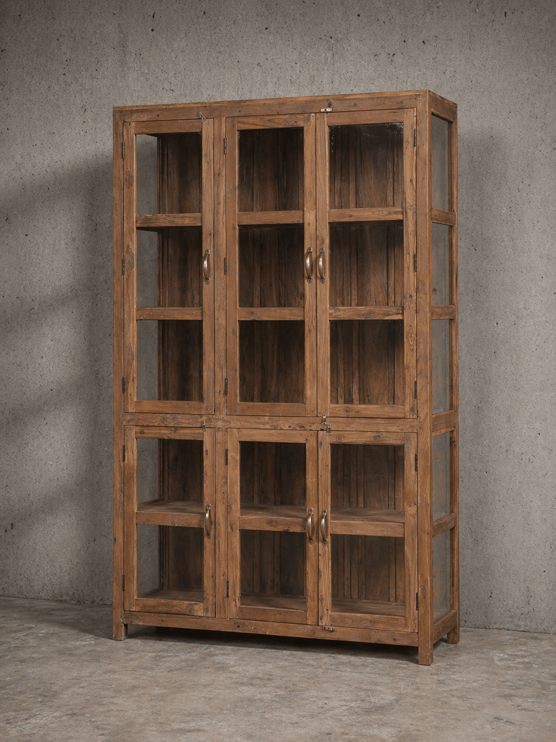 Vintage teak cabinet with glass doors and natural patina – a timeless piece for warm, rustic interiors