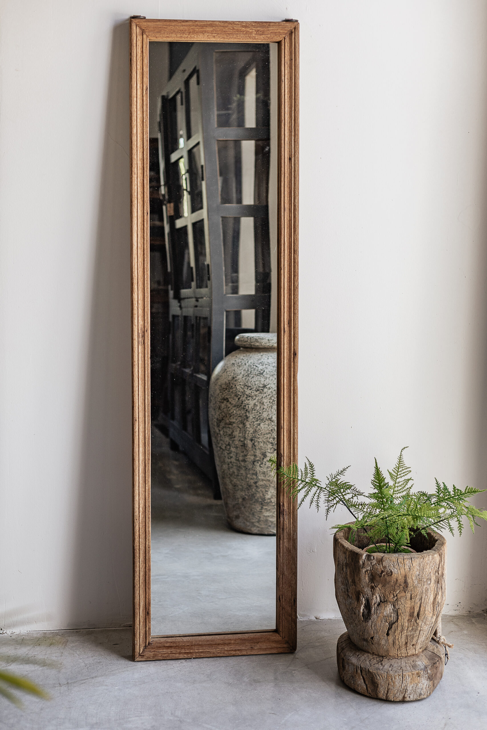 Tall full length reclaimed wood mirror with natural worn grain frame, leaning against wall — Soulosofie Mallorca