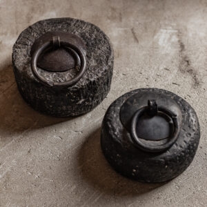 vintage stone door stopper with antique iron ring, raw textured surface — Soulosofie Mallorca
