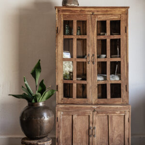 Tall vintage teak kitchen cabinet with glass display doors and solid lower storage, styled with dried lavender and stoneware — Soulosofie Mallorca